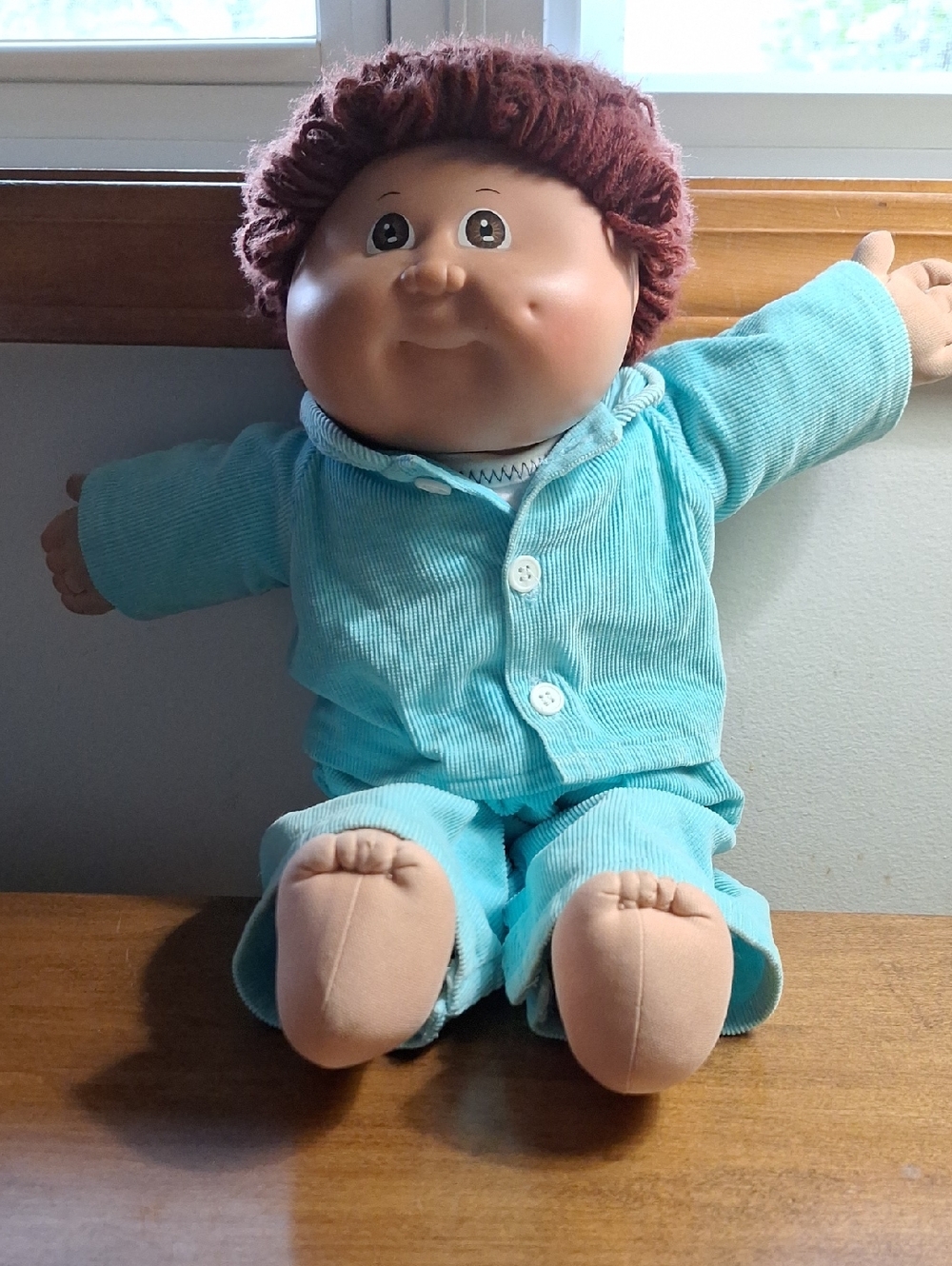 Plush Baby Doll in Teal Outfit – Soft Huggable Play Doll